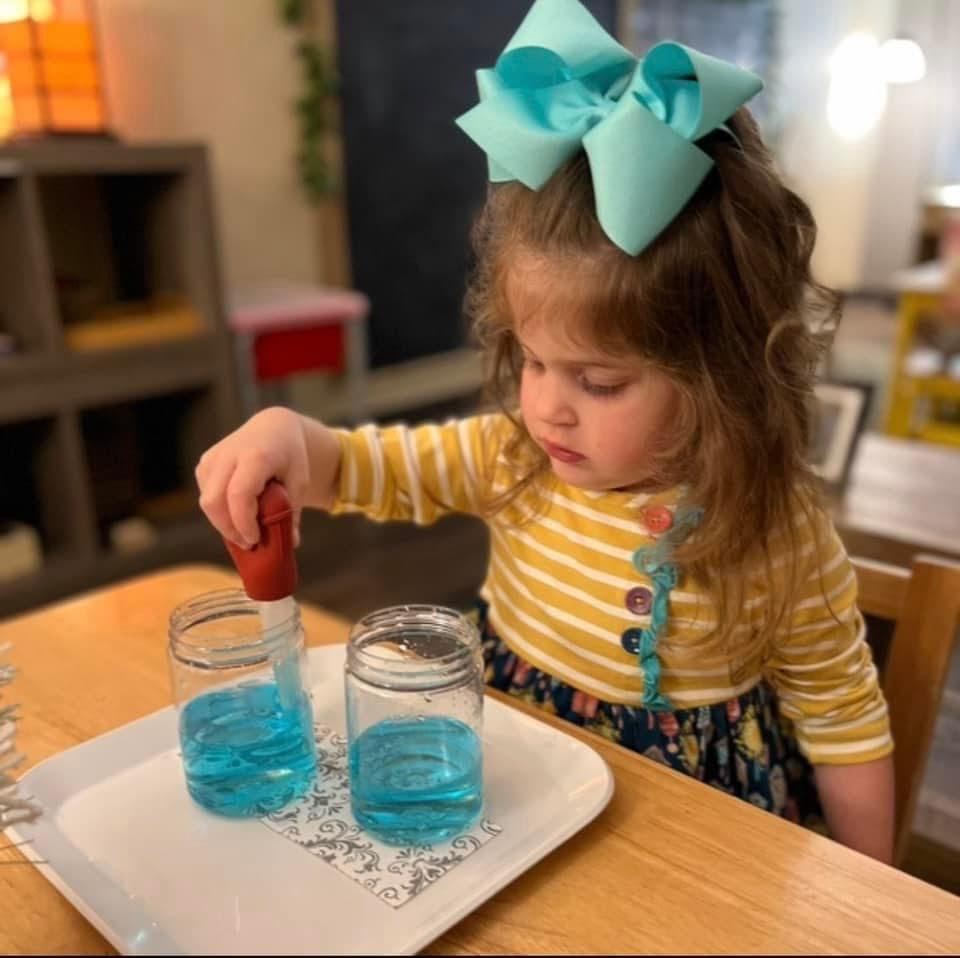 Girl doing a science experiment