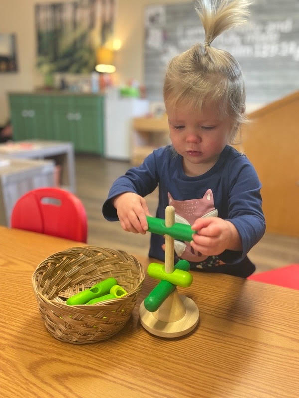 Toddler playing with toy